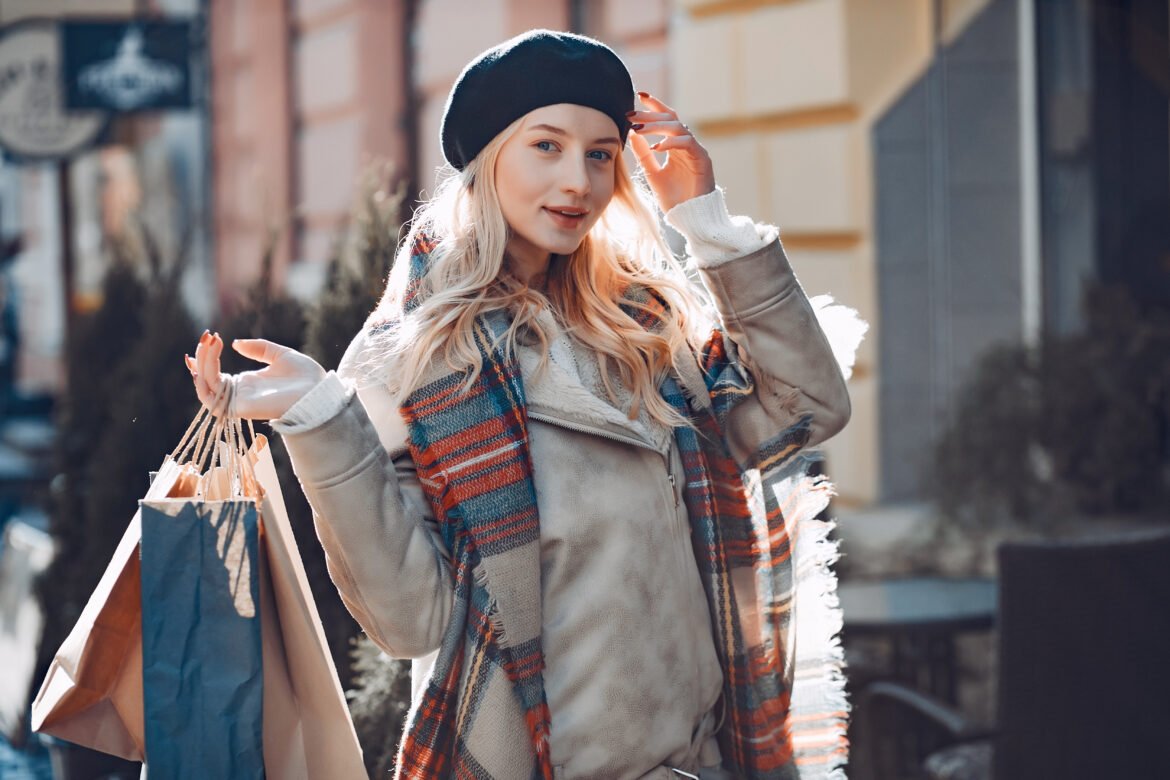 Elegant cute blonde walking in a city